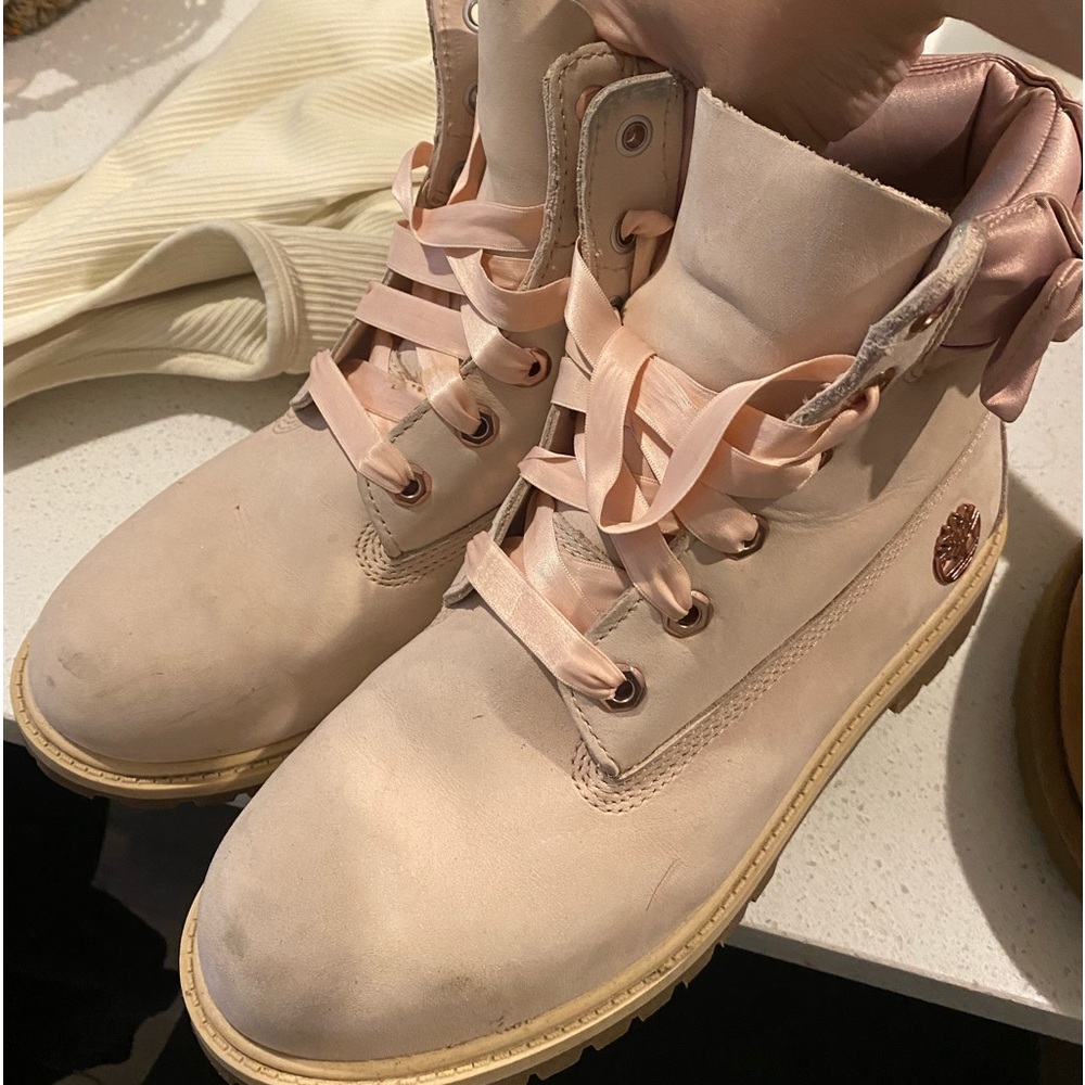 Pink timberland boots with little bow on side